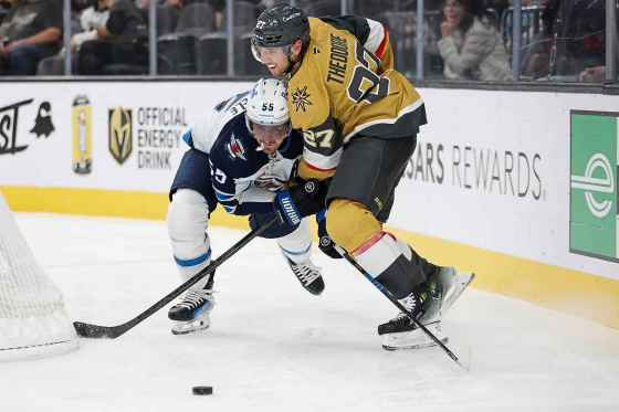 Winnipeg Jets centre Mark Scheifele (55) and Vegas Golden Knights defenceman Shea Theodore (27) collide during the Nov. 29 game. The Golden Knights won 4-3. (Ian Maule / The Associated Press files)