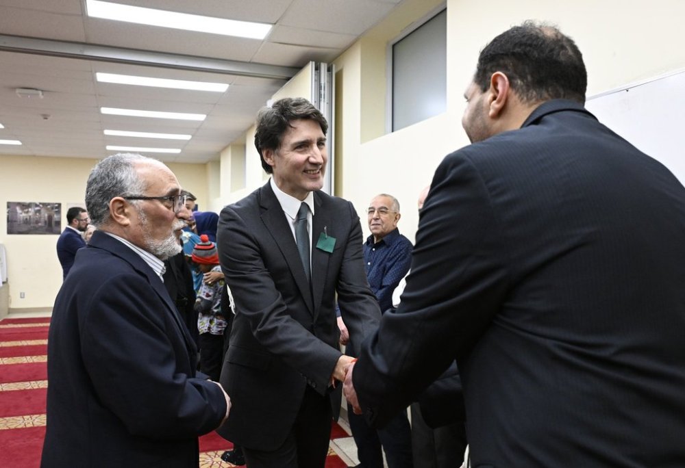 Prime Minister Justin Trudeau alongside Mohamed Labidi, president of the Islamic Cultural Centre, meet with the families of the victims of the Quebec City mosque attack at the Islamic Cultural Centre in Quebec City, Saturday, Jan. 25, 2025. On Jan. 29, 2017, a gunman killed six men and injured 19 others at the mosque. THE CANADIAN PRESS/Jacques Boissinot