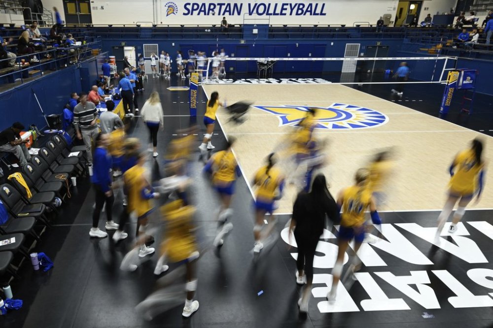 FILE -The San Jose State players take the court for warm ups before an NCAA women's college volleyball match against Air Force, Thursday, Oct. 31, 2024, in San Jose, Calif. (AP Photo/Eakin Howard, File)