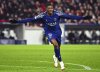 PSG's Ousmane Dembele celebrates scoring his third goal to make it 4-0 during the Champions League opening phase soccer match between Stuttgart and Paris Saint-Germain at the Stuttgart Arena in Stuttgart, Germany, Wednesday, Jan. 29, 2025.. (Tom Weller/dpa via AP)