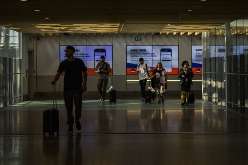 Travellers walk through Pearson Airport in Toronto, Wednesday, July 24, 2024. THE CANADIAN PRESS/Christopher Katsarov