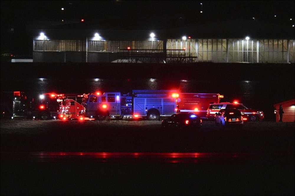First responders are seen at Ronald Reagan Washington National Airport, Wednesday, Jan. 29, 2025, in Arlington, Va. (AP Photo/Julio Cortez)