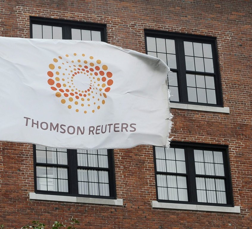 A flag displaying the Thomson Reuters logo flies outside a company building, Monday, Aug. 11, 2008 in Boston. (AP Photo/Lisa Poole)