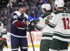 Colorado Avalanche right wing Mikko Rantanen, left, squares off against Minnesota Wild defenseman Jake Middleton before a referee stops the brewing scrum in the third period of an NHL hockey game Monday, Jan. 20, 2025, in Denver. (AP Photo/David Zalubowski)