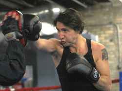 Trudeau working out with Pan Am Boxing Club owner Harry Black ahead of a leadership candidate debate in Winnipeg in 2013. (Joe Bryksa / Free Press files)