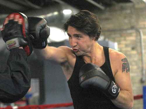 Trudeau working out with Pan Am Boxing Club owner Harry Black ahead of a leadership candidate debate in Winnipeg in 2013. (Joe Bryksa / Free Press files)