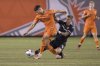 Cavalry FC forward Myer Bevan (9) fights for a ball with Forge FC midfielder Alessandro Hojabrpour (21) during first half Canadian Premier League finals soccer action in Hamilton on Saturday, Oct. 28, 2023. THE CANADIAN PRESS/Nick Iwanyshyn