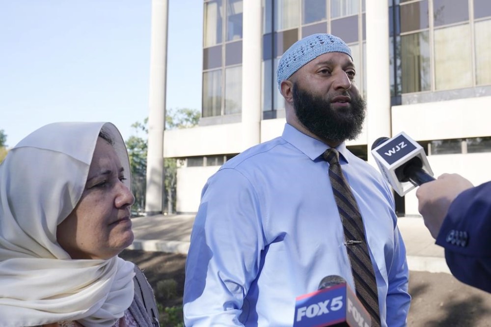 FILE - Adnan Syed and his mother, Shamim Rahman, talk with reporters as they arrive at Maryland's Supreme Court in Annapolis, Md., Thursday, Oct. 5, 2023, to hear arguments in an appeal by Syed, whose conviction for killing his ex-girlfriend more than 20 years ago was chronicled in the hit podcast