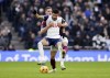 Tottenham Hotspur's Dominic Solanke, front, and Newcastle United's Sven Botman battle for the ball during the English Premier League soccer match between Tottenham Hotspur and Newcastle United at the Tottenham Hotspur Stadium, London, Saturday Jan. 4, 2025. (John Walton/PA via AP)
