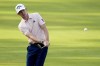 FILE - Tom McKibbin, of Northern Ireland, chips to the green on the 15th hole during the first round of the U.S. Open golf tournament Thursday, June 13, 2024, in Pinehurst, N.C. (AP Photo/Mike Stewart, File)