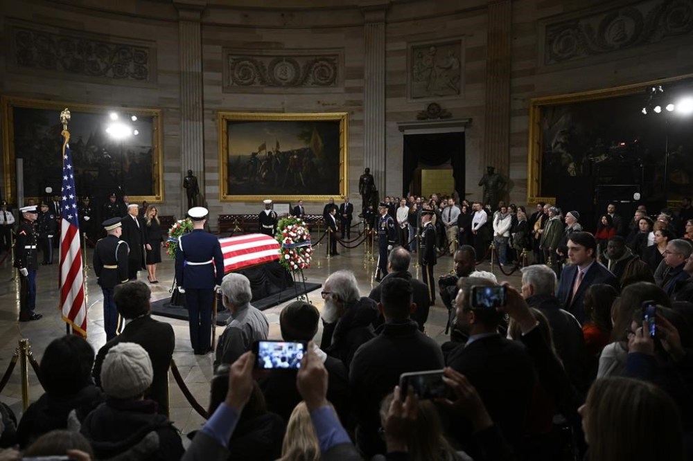 President elect Donald Trump and his wife Melania Trump visit the flag draped casket of the late former President Jimmy Carter as he lies in state at the Rotunda of the U.S. Capitol on Wednesday, Jan. 8, 2025, in Washington. (AP Photo/John McDonnell)