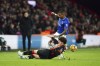 Bournemouth's Milos Kerkez tackles Everton's Ashley Young, top, during the English Premier League soccer match between Bournemouth and Everton at the Vitality Stadium, Bournemouth, England, Saturday Jan. 4, 2025. (Zac Goodwin/PA via AP)