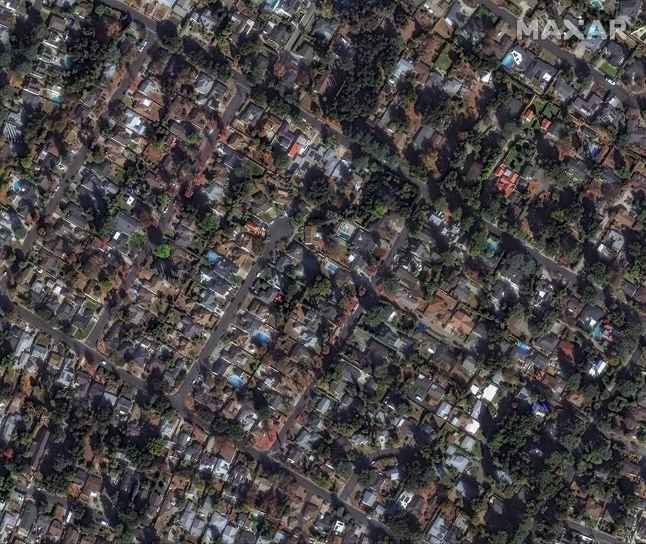This satellite image provided by Maxar Technologies shows buildings near Marathon Road before the Eaton Fire, Wednesday, Jan. 8, 2025, in Altadena, Calif. (Maxar Technologies via AP)