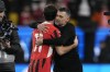 AC Milan's head coach Sergio Conceicao hugs Christian Pulisic after the Italian Super Cup semifinal soccer match between Juventus and Milan in Riyadh, Saudi Arabia, Friday, Jan. 3, 2025. (AP Photo/Altaf Qadri)