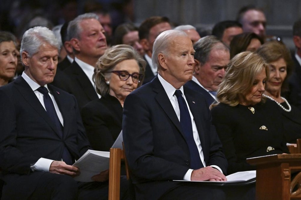Marilyn Quayle, from third row left, former Vice President Al Gore, from second row left, former President Bill Clinton, former Secretary of State Hillary Clinton, former President George W. Bush and his wife former first lady Laura Bush, and from front row left, President Joe Biden and first lady Jill Biden listen during a state funeral for former President Jimmy Carter at the National Cathedral, Thursday, Jan. 9, 2025, in Washington. Looking on in background at seco(Ricky Carioti/The Washington Post via AP, Pool)