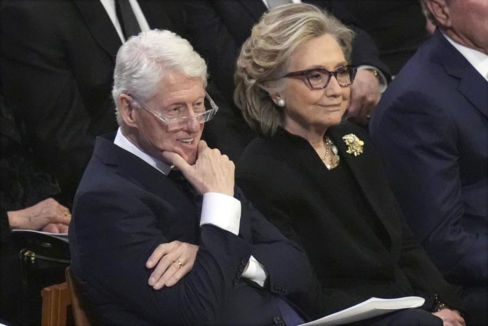 Former President Bill Clinton and former Secretary of State Hillary Clinton listen during the state funeral for former President Jimmy Carter at Washington National Cathedral in Washington, Thursday, Jan. 9, 2025. (AP Photo/Jacquelyn Martin)