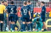 FILE - Bochum goalkeeper Patrick Drewes kneels on the ground after being hit on the head with an object during a Bundesliga soccer match between FC Union Berlin and VfL Bochum, Saturday, Dec. 14, 2024, in Berlin. (Andreas Gora/dpa via AP, File)