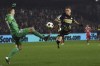 FILE - PSV's Noa Lang, right, misses an opportunity to score as Brest goalkeeper Marco Bizot tries to stop him during the Champions League opening phase soccer match between Brest and PSV Eindhoven in Roudourou stadium, Guingamp, France, Dec. 10, 2024. (AP Photo/Mathieu Pattier, File)