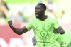 FILE - Wolfsburg's Ridle Baku celebrates scoring during the German Bundesliga soccer match between VfL Wolfsburg and Eintracht Frankfurt, at the Volkswagen Arena, in Wolfsburg, Germany, Sept. 14, 2024. (Swen Pförtner/dpa via AP, File)