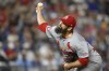 FILE - St. Louis Cardinals relief pitcher Andrew Kittredge throws during the eighth inning of a baseball game against the Kansas City Royals, Friday, Aug. 9, 2024, in Kansas City, Mo. (AP Photo/Reed Hoffmann, File)