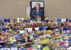 FILE - Tributes from supporters rest at a memorial under a portrait of team owner Vichai Srivaddhanaprabha outside Leicester City Football Club, Monday Oct. 29 2018, in Leicester, England. . (AP Photo/Rui Vieira, File)