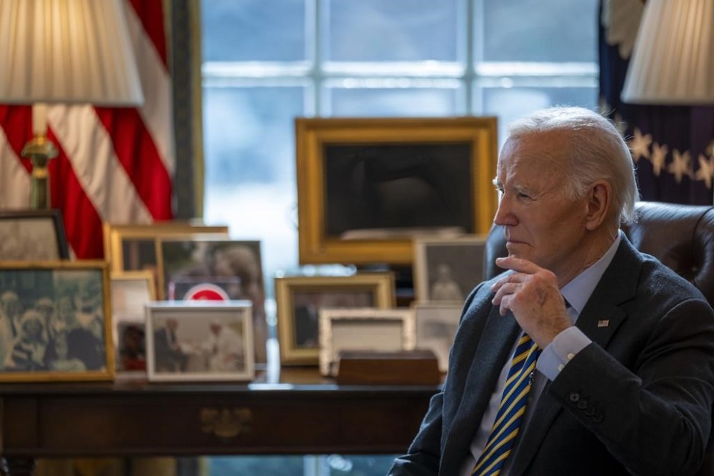President Joe Biden listens during a briefing regarding the federal response to the spread of wildfires in the Los Angeles area, Friday, Jan. 10, 2025, in the Oval Office at the White House in Washington. (AP Photo/Ben Curtis)