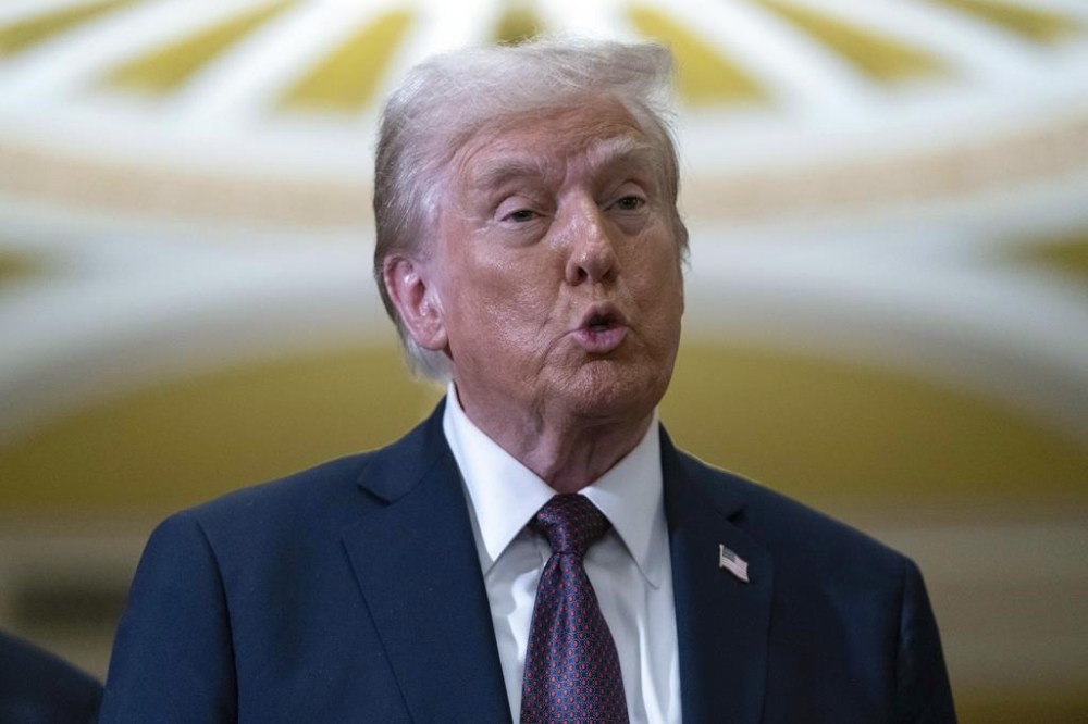 President-elect Donald Trump talks to reporters after a meeting with Republican leadership at the Capitol on Wednesday, Jan. 8, 2025, in Washington. (AP Photo/Jose Luis Magana)