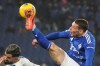 Como's Andrea Belotti challenges for the ball during the Italian Serie A soccer match between Lazio and Como at Rome's Olympic stadium, Friday, Jan. 10, 2025. (AP Photo/Gregorio Borgia)