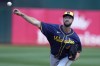 FILE - Milwaukee Brewers pitcher Colin Rea throws during a baseball game against the Oakland Athletics in Oakland, Calif., Saturday, Aug. 24, 2024. (AP Photo/Jeff Chiu, File)