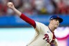 FILE - Philadelphia Phillies relief pitcher Jeff Hoffman delivers during Game 2 of a baseball NL Division Series against the New York Mets, Oct. 6, 2024, in Philadelphia. (AP Photo/Chris Szagola, File)