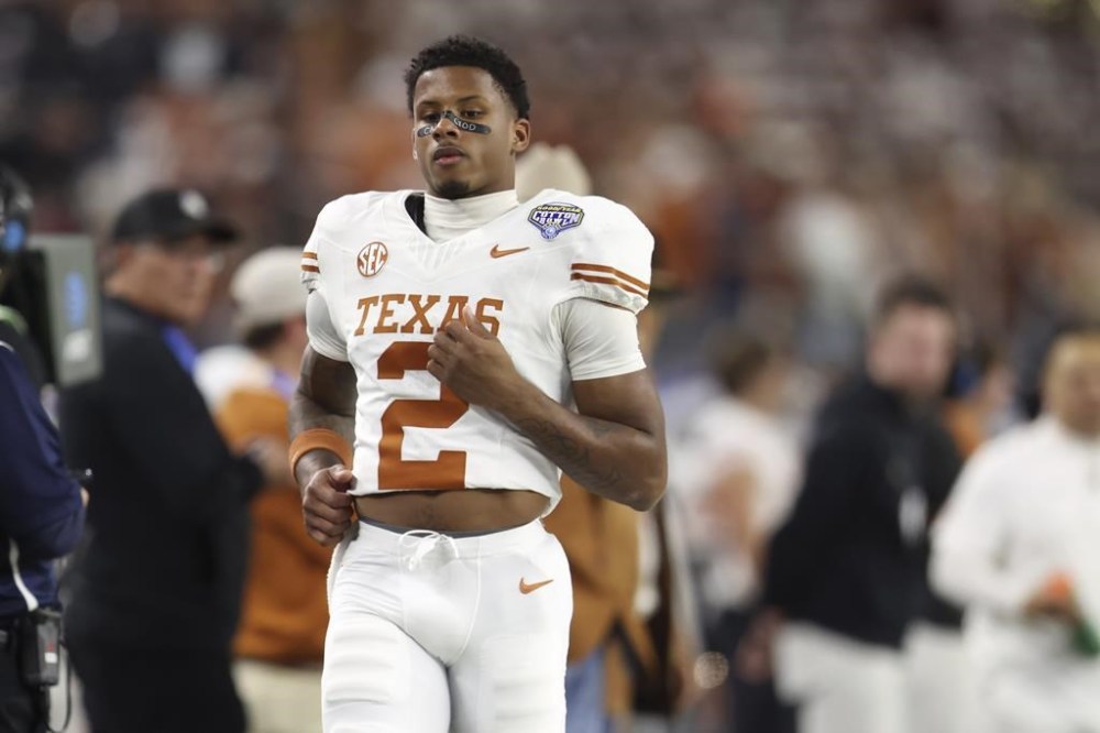 Texas wide receiver Matthew Golden (2) jogs on the sideline during the second half of the Cotton Bowl College Football Playoff semifinal game against Ohio State, Friday, Jan. 10, 2025, in Arlington, Texas. (AP Photo/Gareth Patterson)