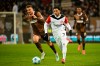 St. Pauli's Hauke Wahl, left and Frankfurt's Omar Marmoush vie for the ball, during the German Bundesliga soccer match between FC St. Pauli and Eintracht Frankfurt, in Hamburg, Germany, Saturday, Jan. 11, 2025. (Gregor Fischer/dpa via AP)