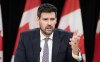 Sean Fraser responds to a question from the media after announcing he is leaving federal politics, Monday, Dec. 16, 2024 in Ottawa. THE CANADIAN PRESS/Adrian Wyld