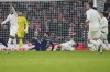 Arsenal's Gabriel Jesus, bottom right, reacts after injuring during the English FA Cup soccer match between Arsenal and Manchester United at the Emirates stadium in London, Sunday, Jan. 12, 2025. (AP Photo/Kin Cheung)