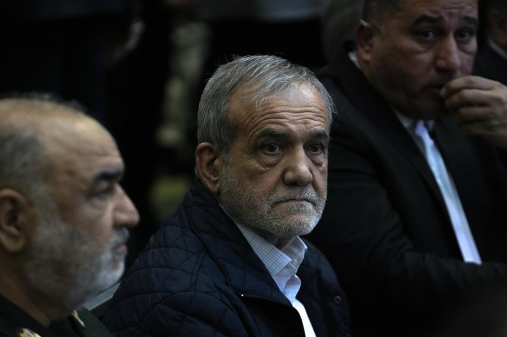 Iranian President Masoud Pezeshkian attends a ceremony marking death anniversary of the late commander of the Revolutionary Guard expeditionary Quds Force, Gen. Qassem Soleimani, who was killed in a U.S. drone attack in 2020, at the Imam Khomeini grand mosque in Tehran, Iran, Thursday, Jan. 2, 2025. (AP Photo/Vahid Salemi)