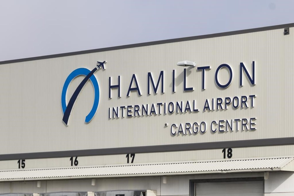 The John C. Munro Hamilton International Airport signage is shown in Hamilton, Ont., Friday, Feb. 23, 2024. THE CANADIAN PRESS/Nick Iwanyshyn