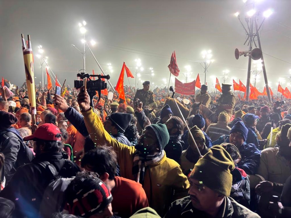 Policemen on horseback control the crowd at the confluence of the Ganges, the Yamuna and the mythical Saraswati rivers on Makar Sankranti, an auspicious bathing day of the 45-day-long Maha Kumbh festival in Prayagraj, India, Tuesday, Jan. 14, 2025. (AP Photo/Ashwini Bhatia)