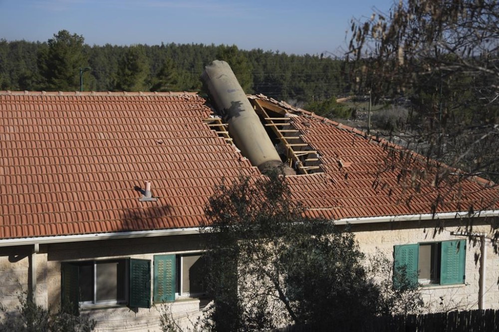 A part of a missile fired by Yemen's Houthi rebels is casing on the roof of a house in the Israeli village of Mevo Beitar, near Jerusalem, on Tuesday, Jan. 14, 2025. (AP Photo/Ohad Zwigenberg)