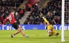 Southampton's Tyler Dibling, left, scores his side's second goal of the game during the English FA Cup third round soccer match between Southampton and Swansea City, at St Mary's Stadium, in Southampton, England, Sunday, Jan. 12, 2025. (John Walton/PA via AP)