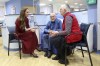 Britain's Princess Kate, left, talks with Richard Bosworth, centre, during a visit to The Royal Marsden Hospital, where she received her cancer treatment, in London, Tuesday Jan. 14, 2025 in London, England. (Chris Jackson/Pool Photo via AP)