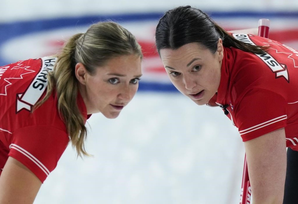 Team Canada lead Briane Harris, left, and third Val Sweeting sweep while playing Prince Edward Island at the Scotties Tournament of Hearts, in Kamloops, B.C., on Monday, February 20, 2023. The lawyer for Harris says Court of Arbitration for Sport has lifted the Canadian curler's provisional suspension for an anti-doping rule violation, ruling she can return to the sport with