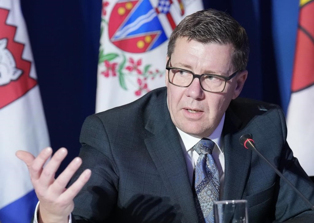 Saskatchewan Premier Scott Moe speaks to the media during the fall meetings of Canada's premiers hosted by Ontario in Toronto, Monday, Dec. 16, 2024. THE CANADIAN PRESS/Nathan Denette