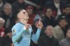 Manchester City's Phil Foden celebrates after scoring the opening goal against Brentford during the English Premier League soccer match between Brentford and Manchester City at the Gtech Community stadium, in London, England, Tuesday, Jan. 14, 2025. (AP Photo/Alastair Grant)