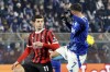 Como's Gabriel Strefezza, right, and AC Milan's Christian Pulisic in action during the Serie A soccer match between Como and Milan at the Giuseppe Sinigaglia stadium in Como, Italy, Sunday Jan. 14, 2025. (Antonio Saia/LaPresse via AP)