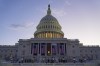 The sun rises as a rehearsal begins for President-elect Donald Trump's upcoming inauguration on the West Front of the U.S. Capitol, Sunday, Jan. 12, 2025, in Washington. (AP Photo/Jon Elswick)