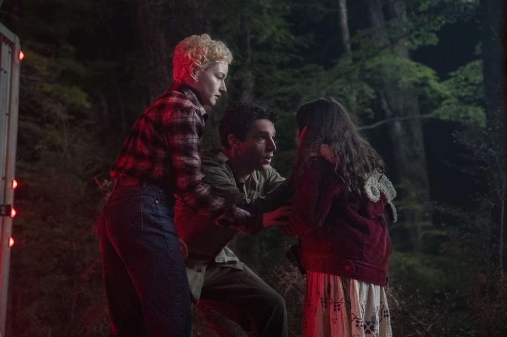 This image released by Universal Pictures shows Julia Garner, from left, Christopher Abbott, and Matilda Firth in a scene from