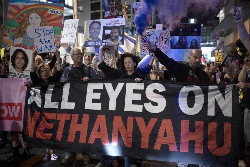 FILE - Relatives of Israelis held hostage by Hamas in the Gaza Strip and their supporters protest outside of the hotel where U.S. Secretary of State Antony Blinken is staying during a visit with Israeli leadership in Tel Aviv, on Oct. 22, 2024. (AP Photo/Maya Alleruzzo, File)