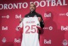 Robin Fraser, Toronto FC's new head coach, holds up a team jersey with his name during a press conference in Toronto, Wednesday, Jan. 15, 2025. THE CANADIAN PRESS/Nathan Denette
