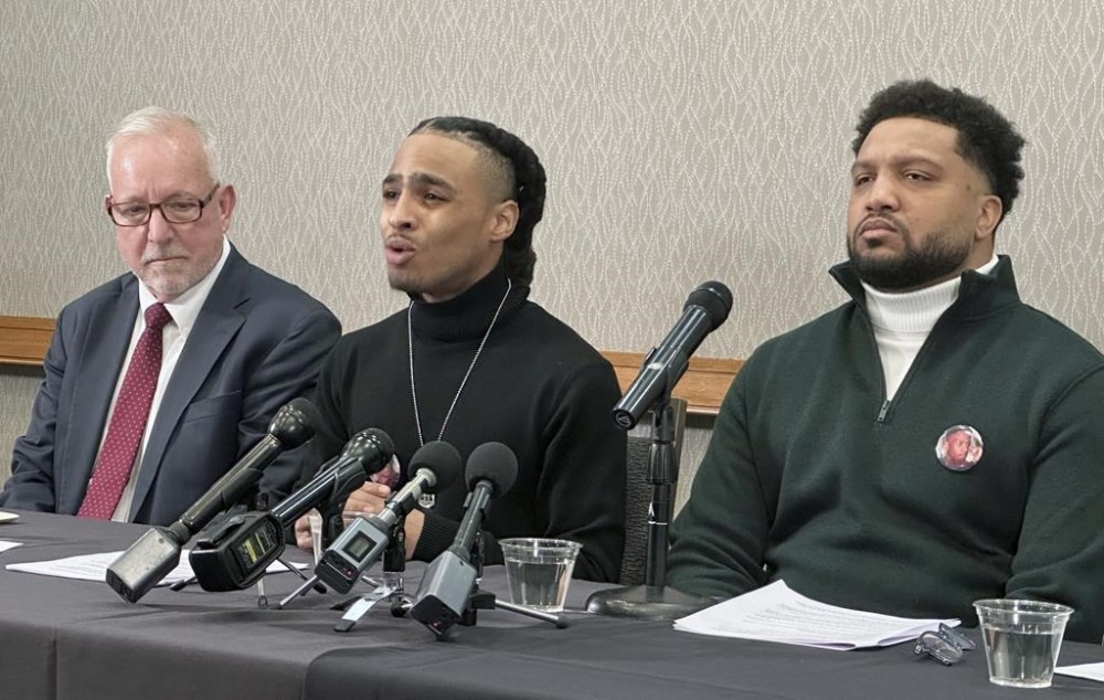 Robert Brooks Jr. speaks during a news conference as his lawyer Steve Schwarz, left and Jared Ricks, listen in Rochester, N.Y., Wednesday, Jan. 15, 2024. (AP Photo/Carolyn Thompson)
