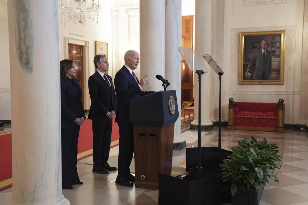 President Joe Biden, right, with Vice President Kamala Harris, left, and Sec. of State Anthony Blinken, center, speaks in the Cross Hall of the White House on the announcement of a ceasefire deal in Gaza and the release of dozens of hostages after more than 15 months of war, Wednesday, Jan. 15, 2025, in Washington. (AP Photo/Evan Vucci)
